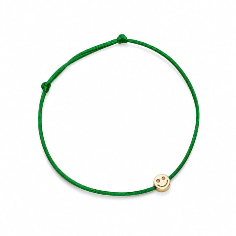 MARGOVA The Golden One bracelet with 14k solid yellow gold smiley face bead on an adjustable cord.