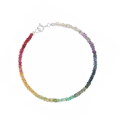 Custom-made fine gemstone bracelet by MARGOVA with a unique rainbow creation. Features stunning variations of Ruby, Sapphires & Emerald, and round clasp made of 925 sterling silver.