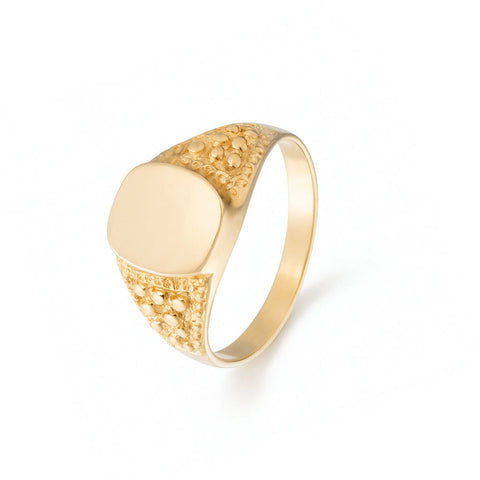 A solid 14k yellow gold signet ring with a glossy polished surface and round 3D details on the metal band.