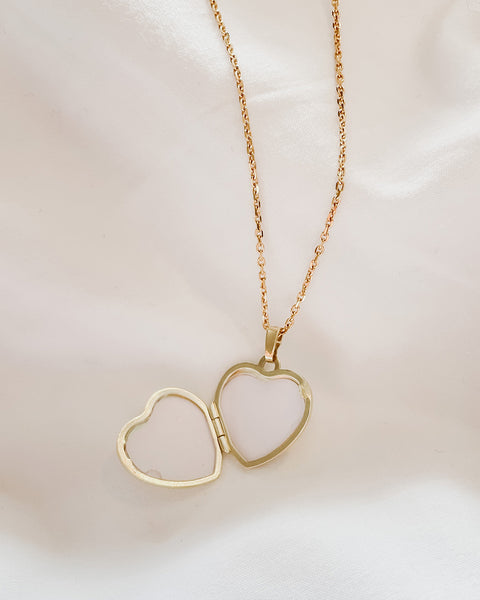 Close-up view of 'LoveLock' Heart Locket Pendant - a heart-shaped locket pendant with frosted and polished sides, designed for two cherished pictures. Handmade with care and uniqueness in mind.